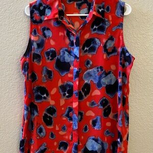 Summer top, button down, wear alone or use as an outer shirt! Slit in the back!